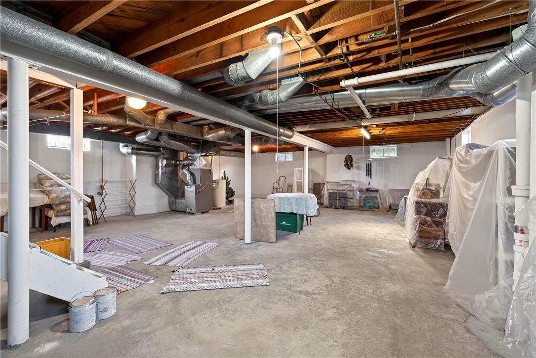 1237 Laurelwood Road Dayton, OH 45409 - Photo 35 of 56 This spacious basement offers a versatile area for future customization and utility access.