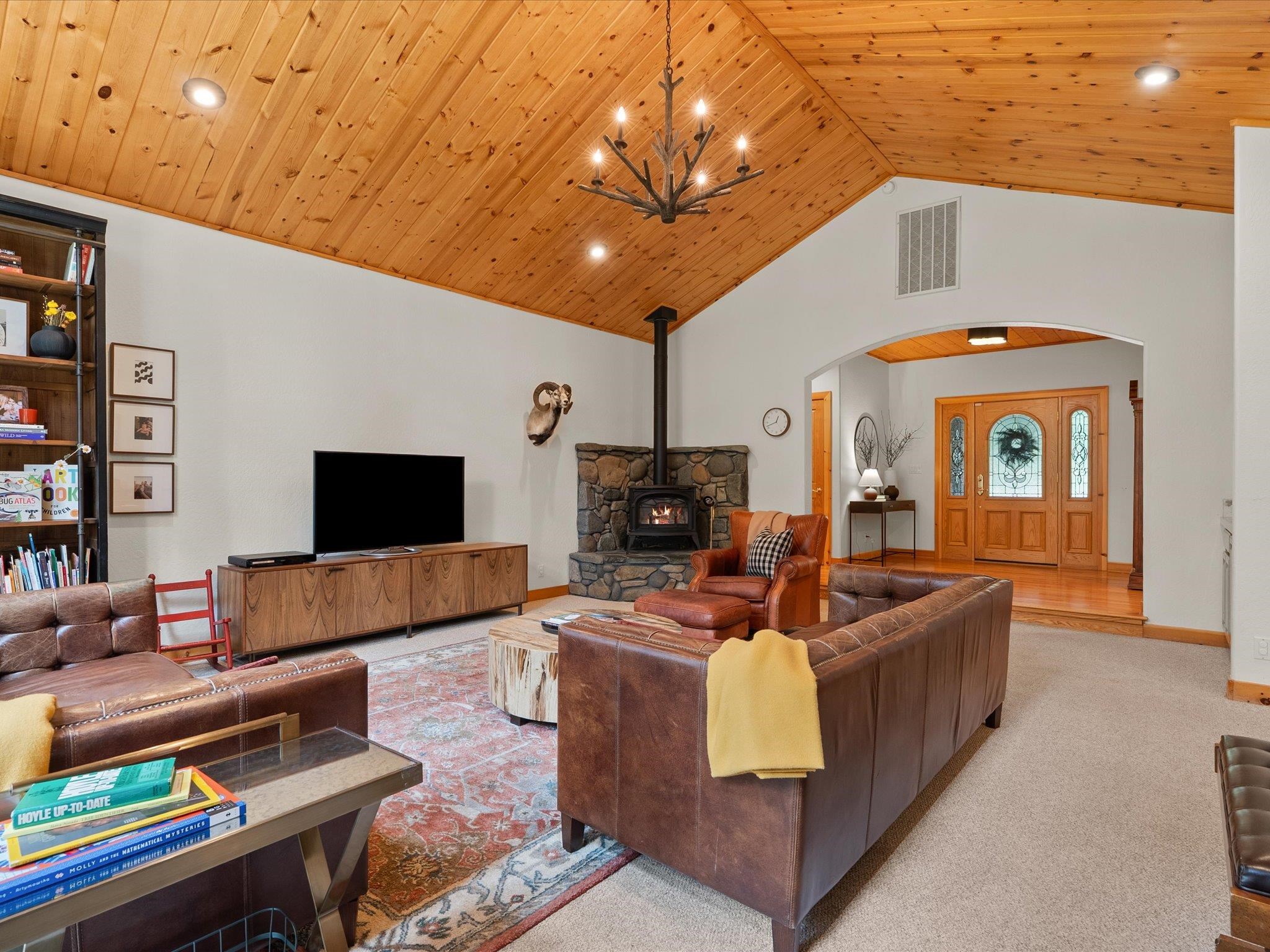 355 Quail View Circle Clio, CA 96106 - Photo 13 of 48 a living room with furniture and a flat screen tv
