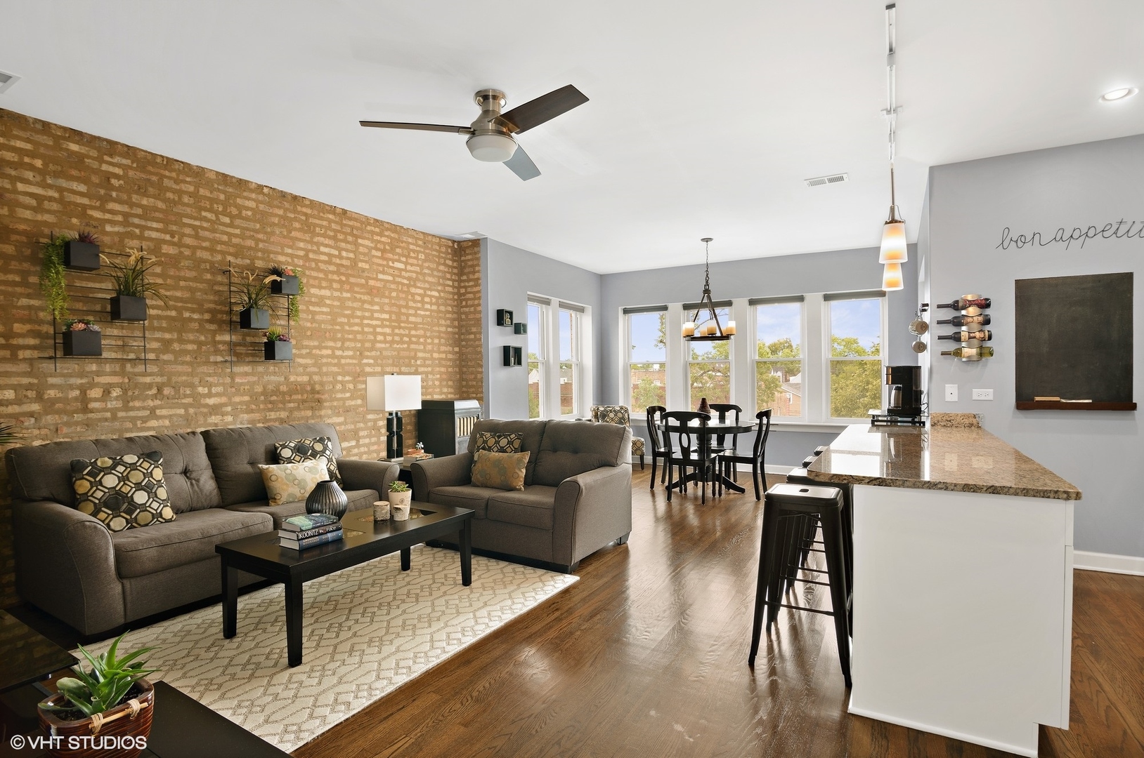 2116 North Spaulding Avenue, Unit 21163 Chicago, IL 60647 - Photo 2 of 18 a living room with fireplace furniture and a flat screen tv