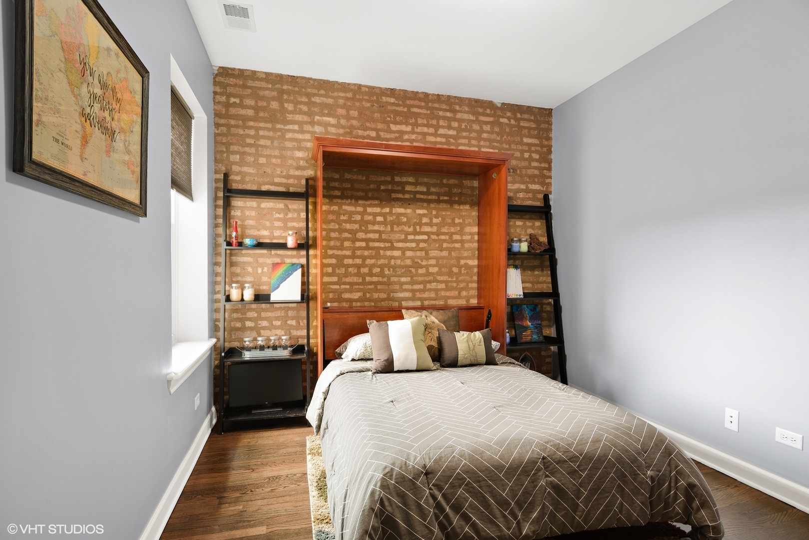 2116 North Spaulding Avenue, Unit 21163 Chicago, IL 60647 - Photo 12 of 18 a bedroom with a bed and window