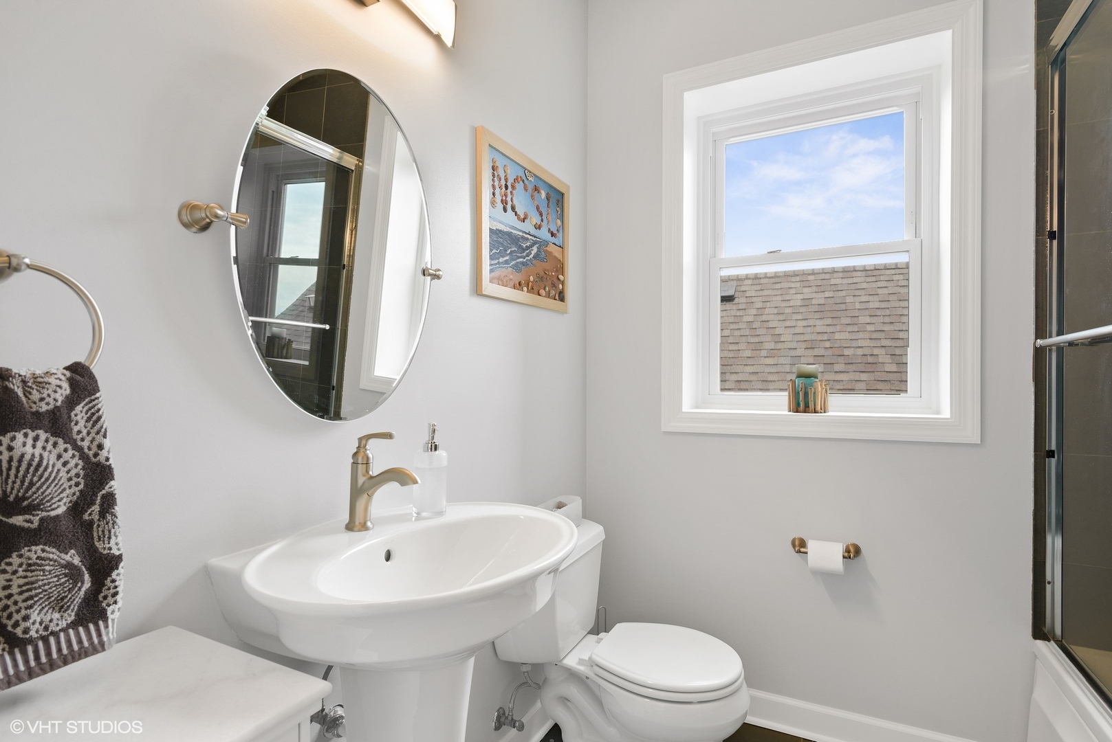 2116 North Spaulding Avenue, Unit 21163 Chicago, IL 60647 - Photo 14 of 18 a bathroom with a toilet sink and mirror