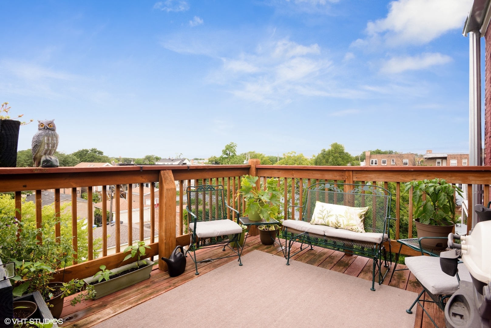 2116 North Spaulding Avenue, Unit 21163 Chicago, IL 60647 - Photo 15 of 18 a balcony with chairs and city view
