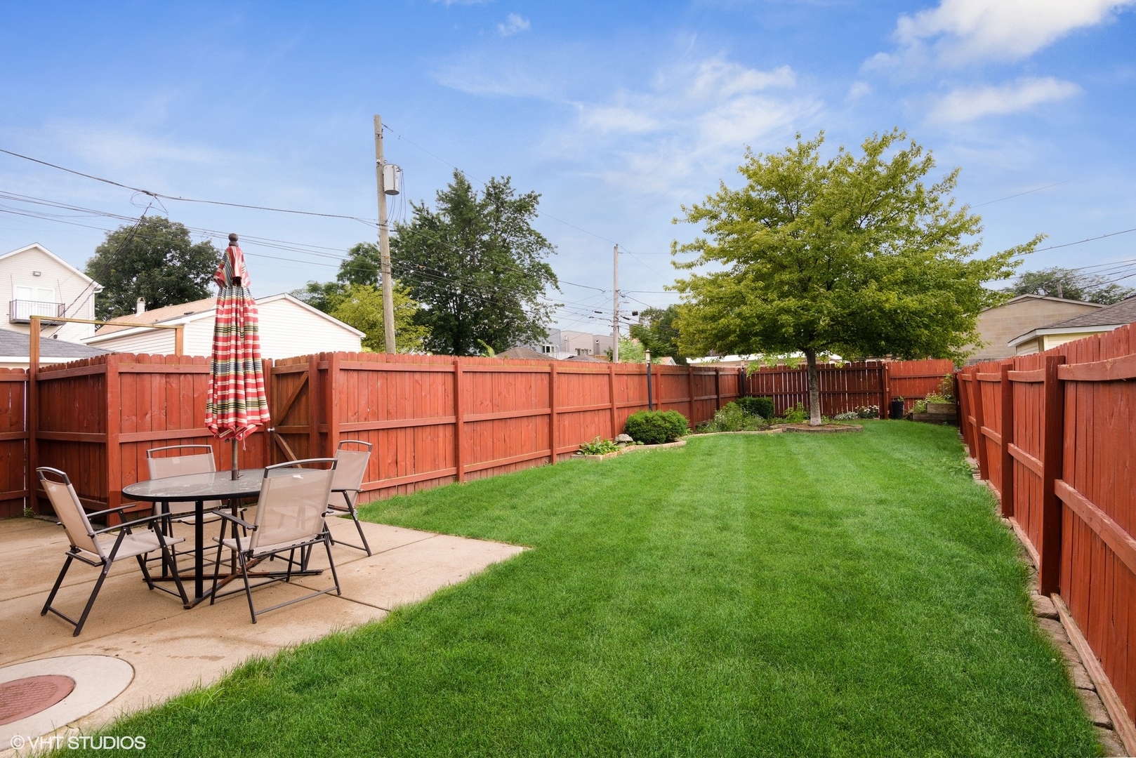 2116 North Spaulding Avenue, Unit 21163 Chicago, IL 60647 - Photo 17 of 18 a view of a backyard with table and chairs and potted plants and big yard
