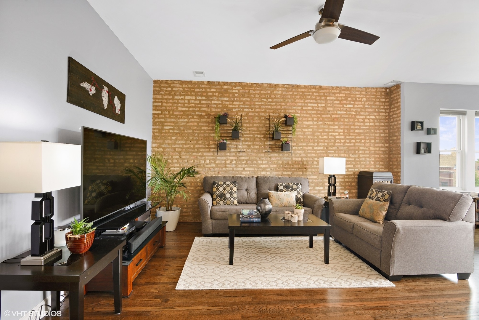 2116 North Spaulding Avenue, Unit 21163 Chicago, IL 60647 - Photo 3 of 18 a living room with furniture and a flat screen tv