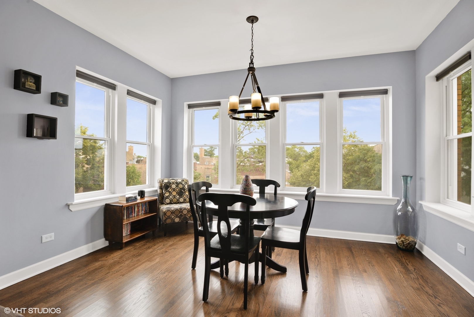2116 North Spaulding Avenue, Unit 21163 Chicago, IL 60647 - Photo 4 of 18 a view of a dining room with furniture window and wooden floor