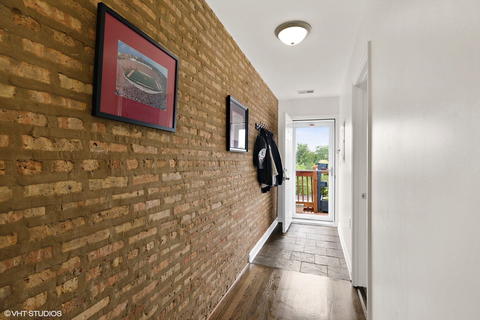 2116 North Spaulding Avenue, Unit 21163 Chicago, IL 60647 - Photo 8 of 18 a hallway with a door and a white wall