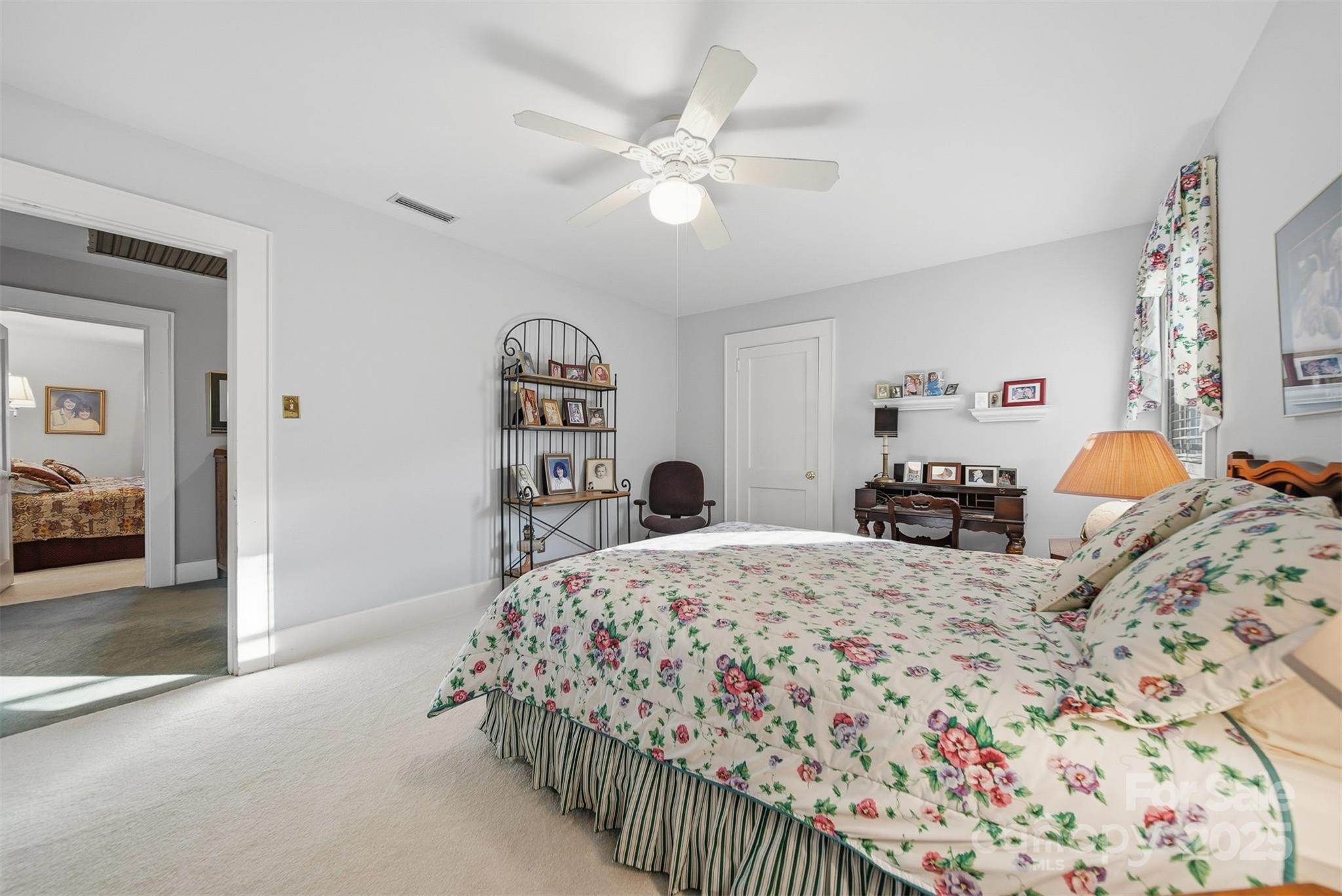 619 4th Street Northeast Hickory, NC 28601 - Photo 19 of 38 a bedroom with a large bed and a chandelier
