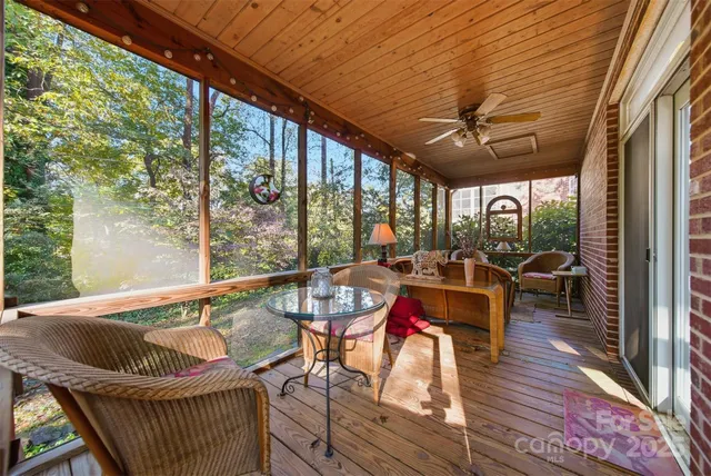 a view of deck with table and chairs with wooden floor and outdoor seating