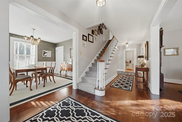 a view of entryway and hall with wooden floor