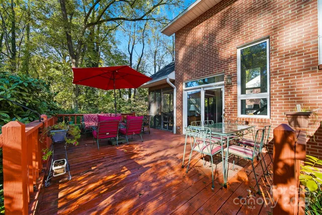 a view of a house with backyard sitting area and a patio