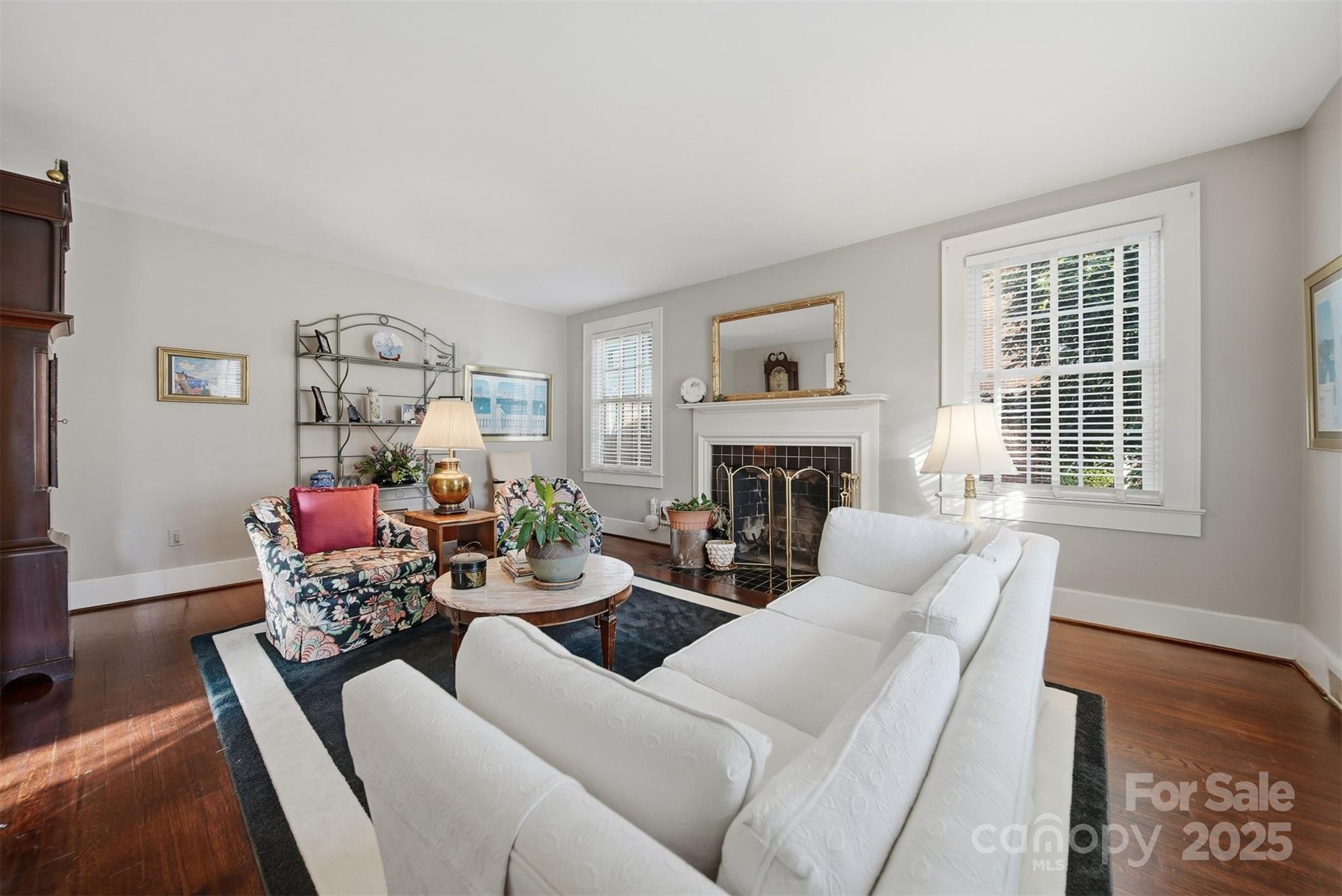 619 4th Street Northeast Hickory, NC 28601 - Photo 4 of 38 a living room with furniture and a fireplace