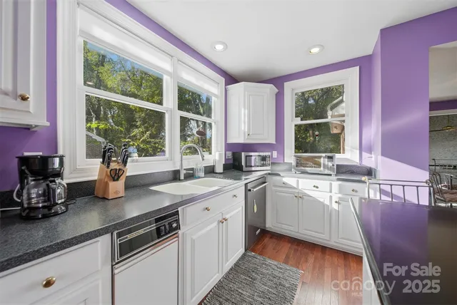 a kitchen with sink and window