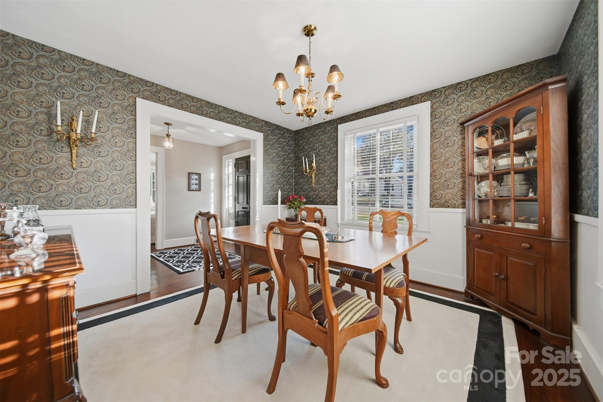 619 4th Street Northeast Hickory, NC 28601 - Photo 9 of 38 a view of a dining room with furniture and a chandelier
