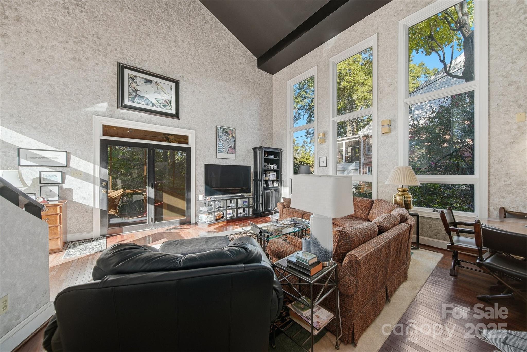 619 4th Street Northeast Hickory, NC 28601 - Photo 10 of 38 a living room with furniture a flat screen tv and a large window