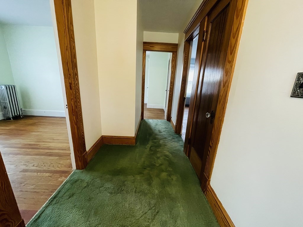 22 Thames Street Springfield, MA 01104 - Photo 12 of 15 a view of a hallway with door