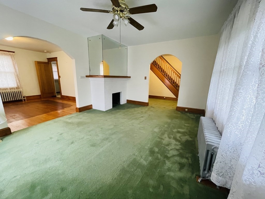 22 Thames Street Springfield, MA 01104 - Photo 5 of 15 a view of a livingroom with a furniture ceiling fan and window