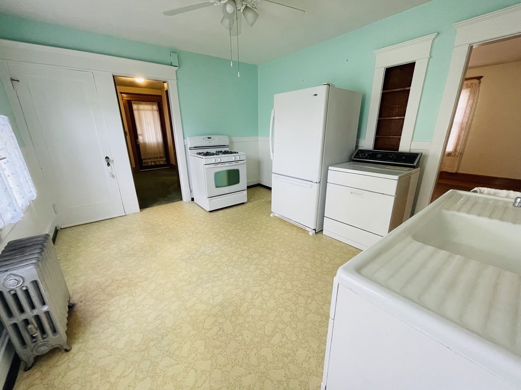 22 Thames Street Springfield, MA 01104 - Photo 6 of 15 a room with furniture and a flat screen tv