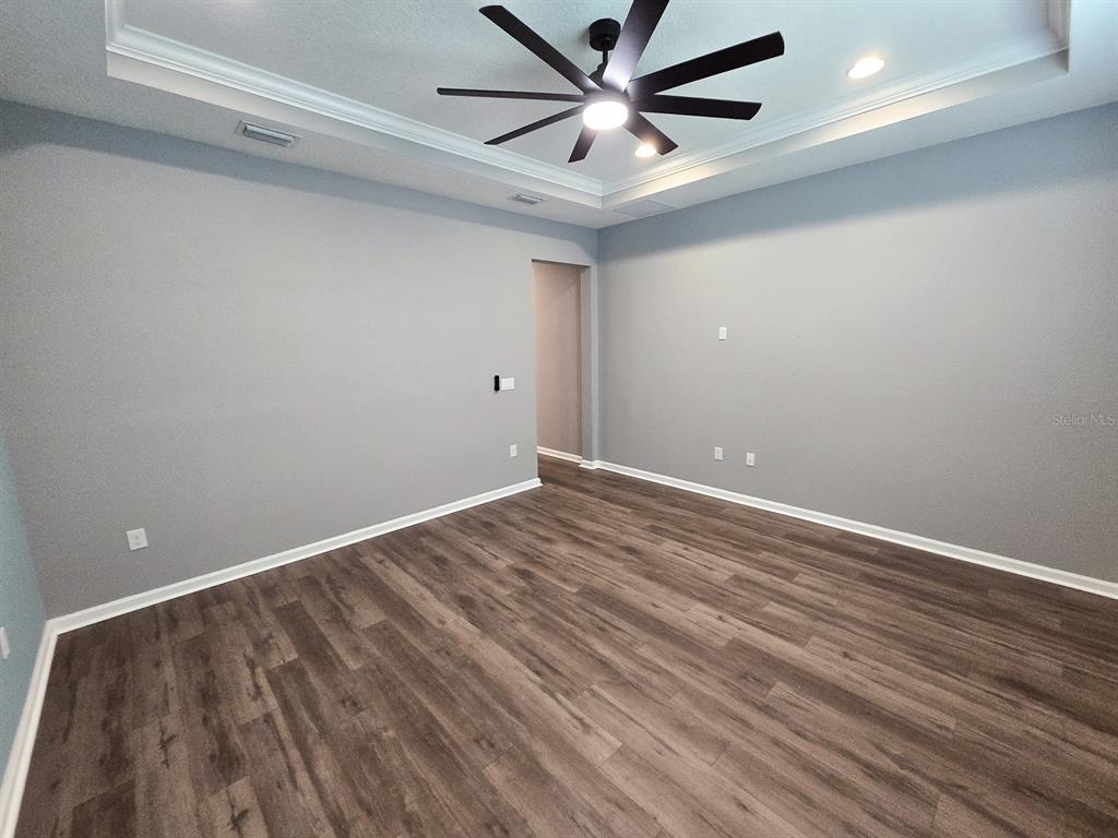 3543 Meadow Breeze Loop Ocoee, FL 34761 - Photo 18 of 38 wooden floor in an empty room
