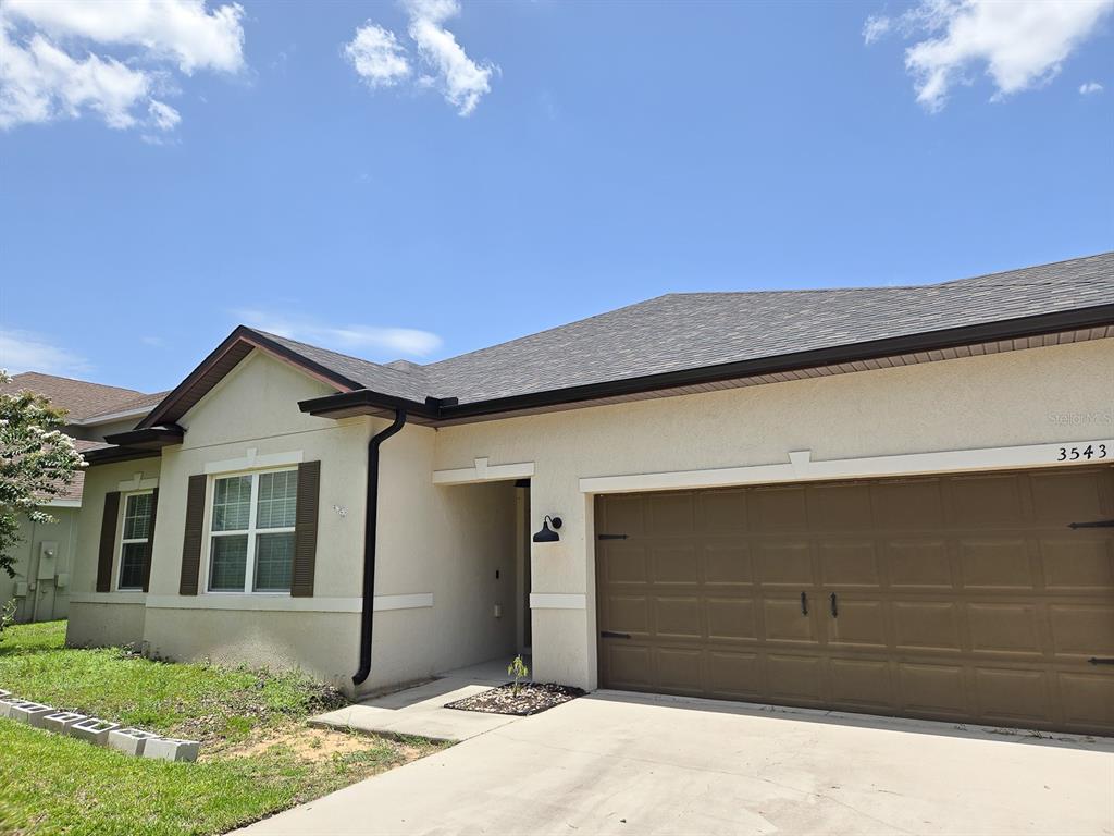 3543 Meadow Breeze Loop Ocoee, FL 34761 - Photo 2 of 38 a front view of a house