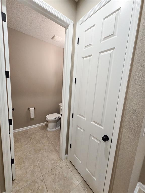3543 Meadow Breeze Loop Ocoee, FL 34761 - Photo 25 of 38 a bathroom with a sink and a toilet