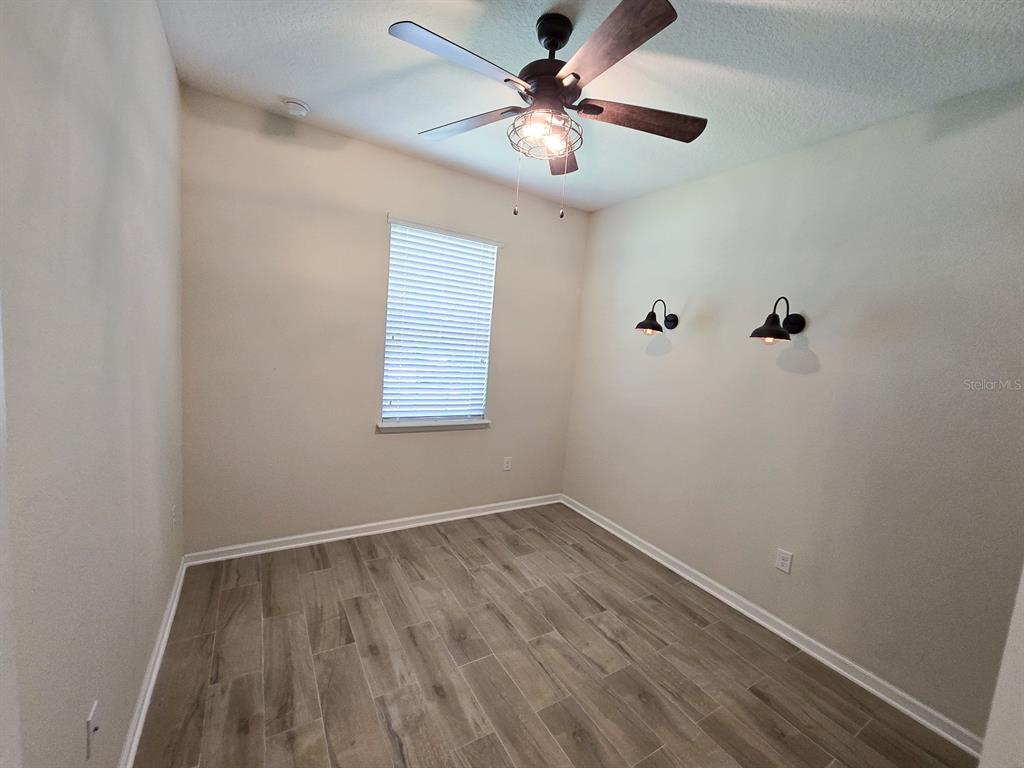 3543 Meadow Breeze Loop Ocoee, FL 34761 - Photo 30 of 38 an empty room with a window and a fan