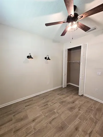 a utility room with cabinets washer and dryer