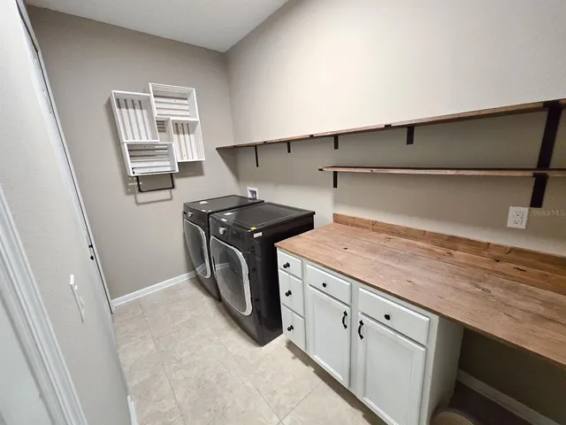 a view of a ceiling fan and wooden floor