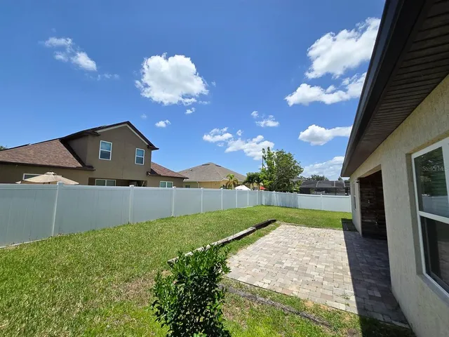 a house view with a backyard space