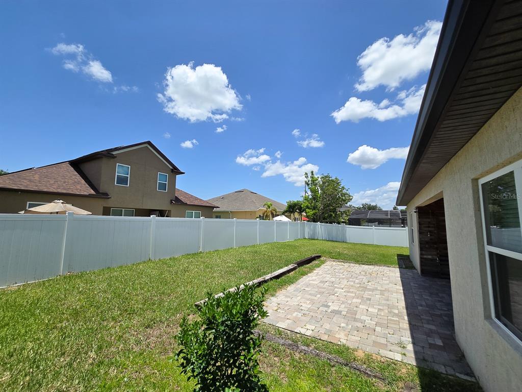 3543 Meadow Breeze Loop Ocoee, FL 34761 - Photo 34 of 38 a view of a backyard with a garden