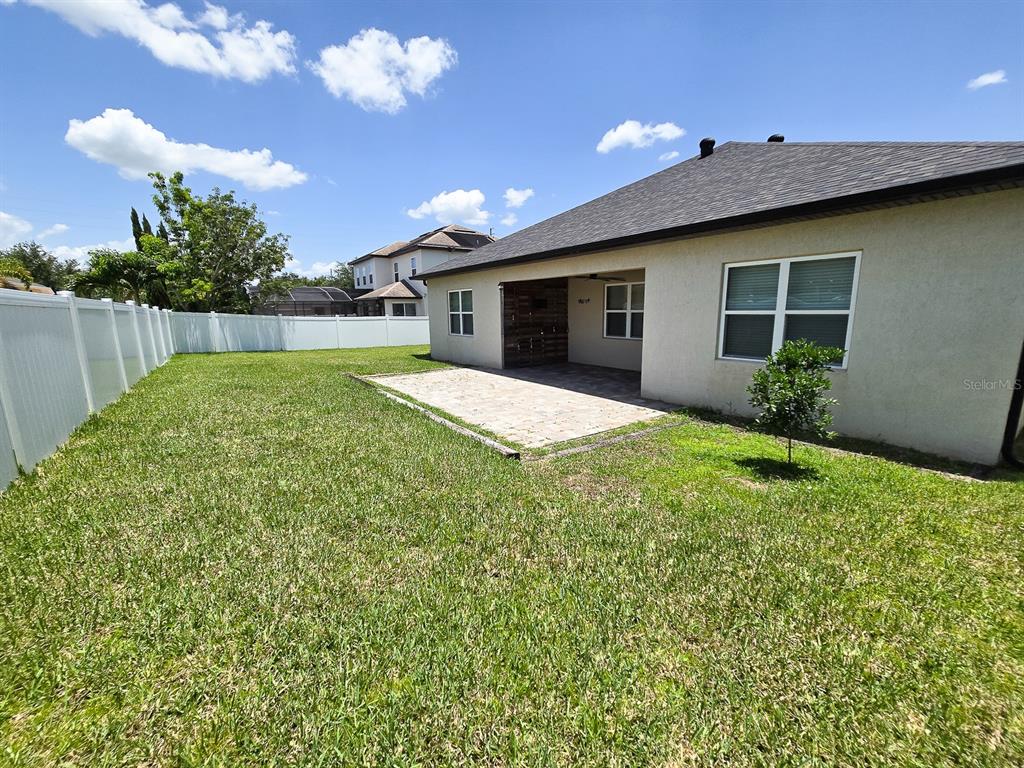 3543 Meadow Breeze Loop Ocoee, FL 34761 - Photo 35 of 38 a house view with a backyard space