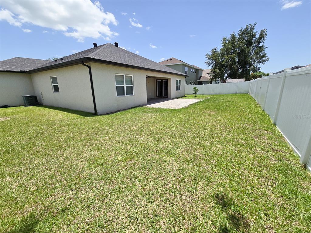 3543 Meadow Breeze Loop Ocoee, FL 34761 - Photo 36 of 38 a house with trees in front of it