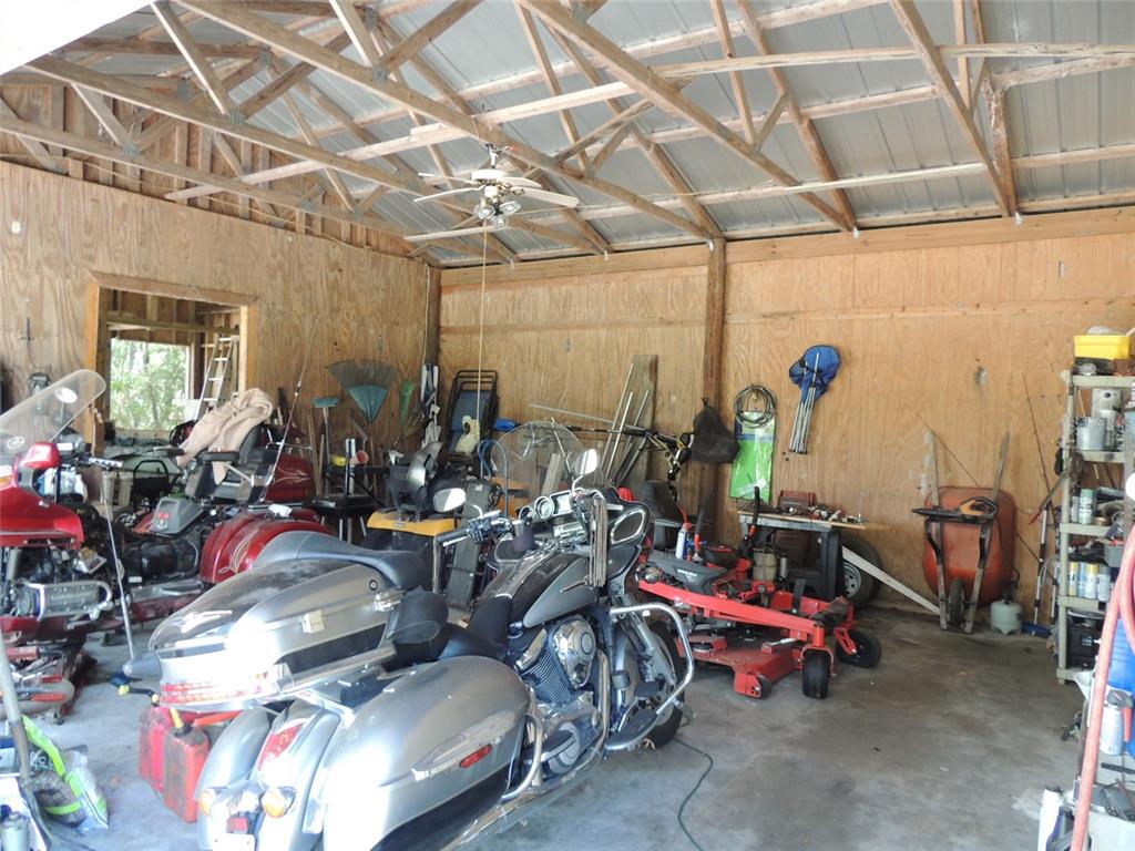 7050 Southeast Co Road 337 Morriston, FL 32668 - Photo 18 of 67 a view of a storage room with lots of stuff