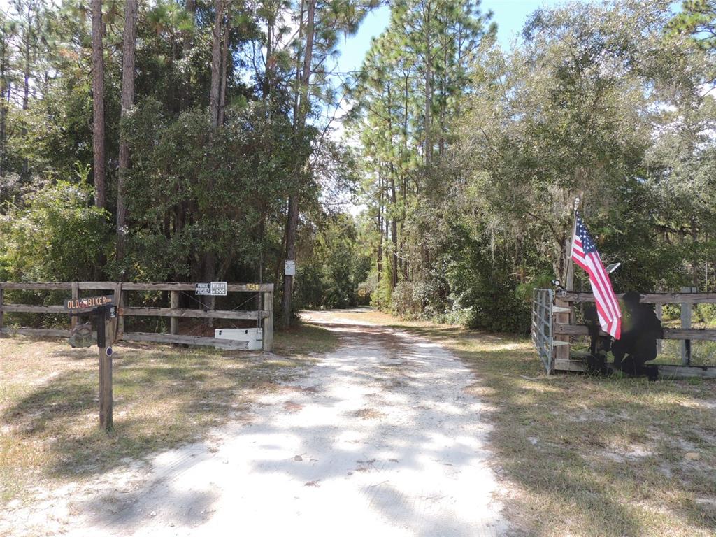 7050 Southeast Co Road 337 Morriston, FL 32668 - Photo 3 of 67 a view of outdoor space with playground and green space