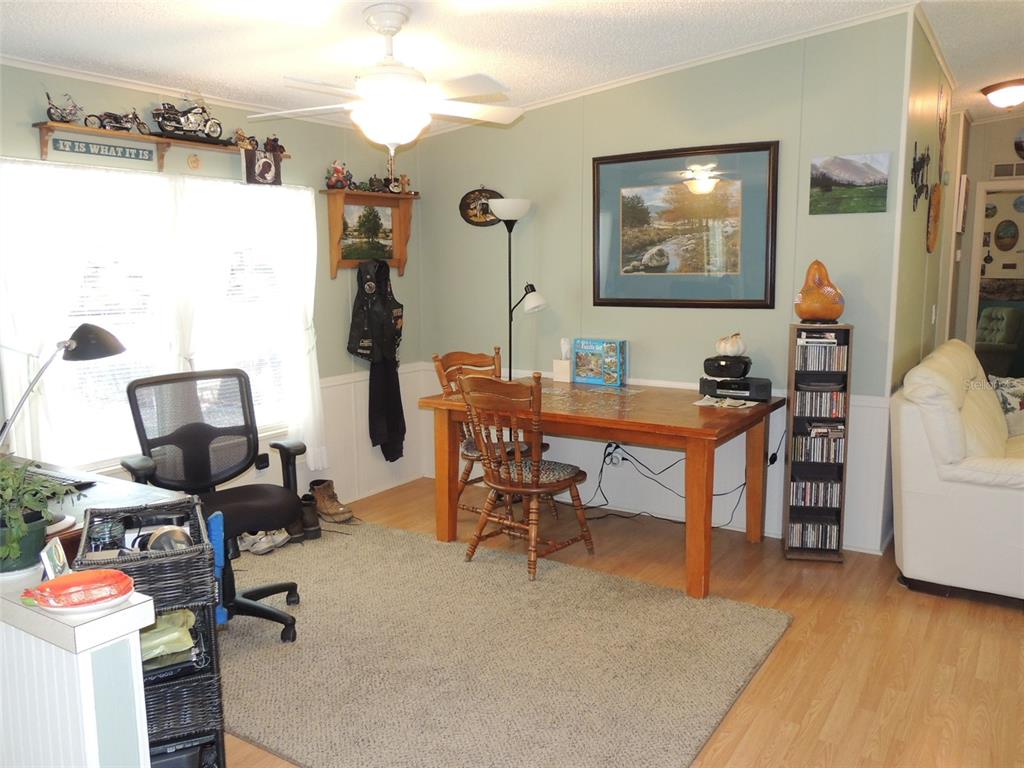 7050 Southeast Co Road 337 Morriston, FL 32668 - Photo 33 of 67 a view of a workspace with furniture and a room