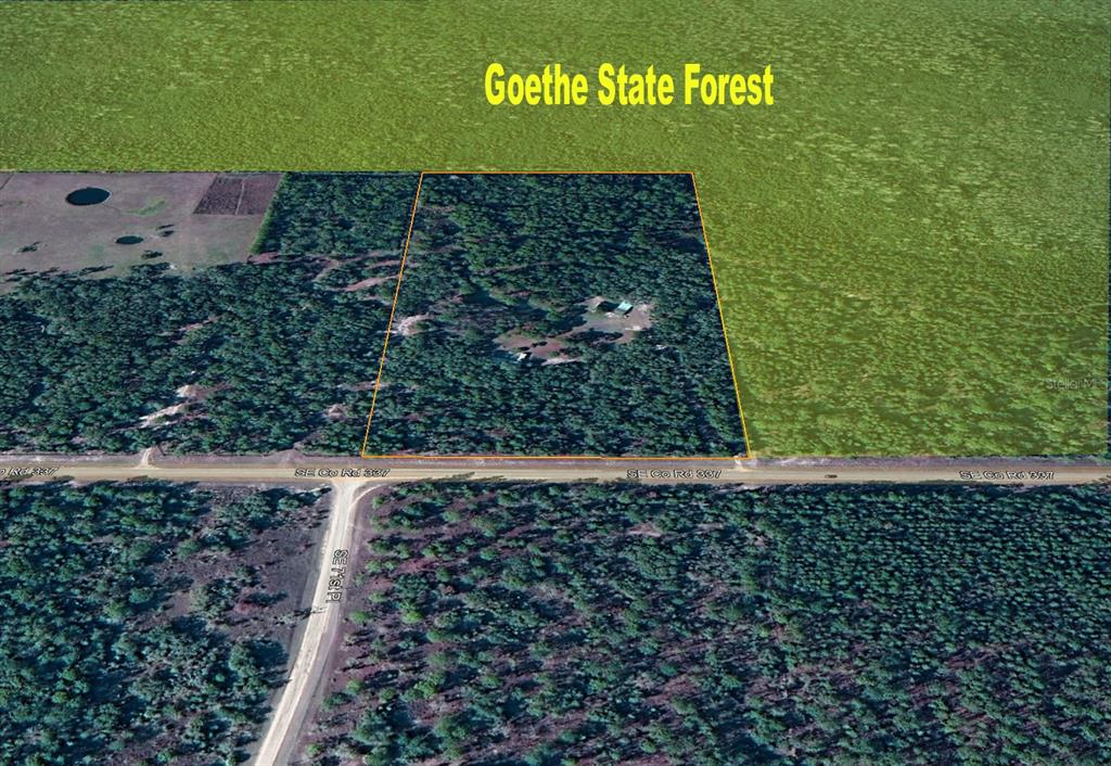 7050 Southeast Co Road 337 Morriston, FL 32668 - Photo 67 of 67 a sign that is sitting in front of a tree