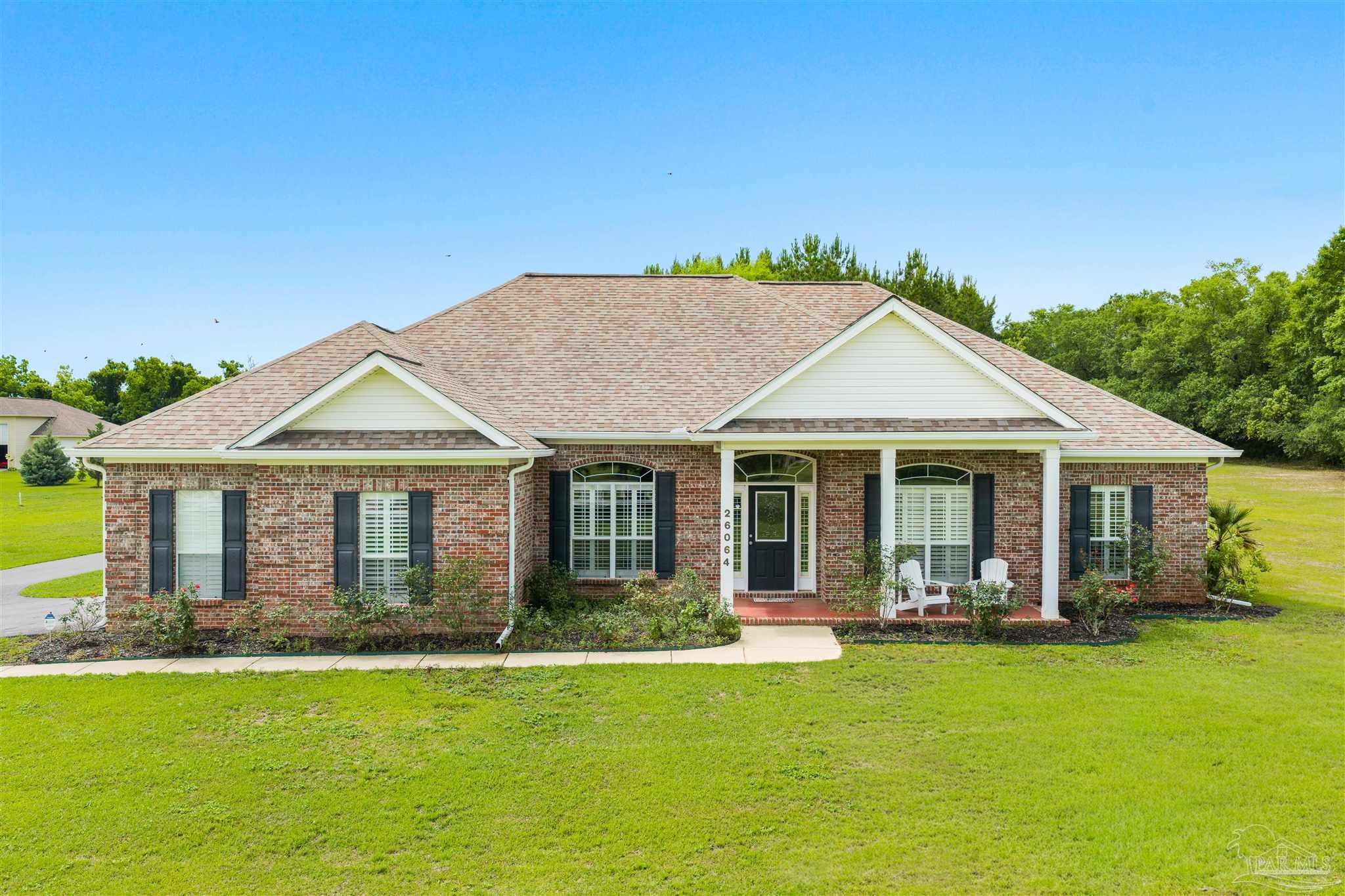 26064 Chatelaine Road Elberta, AL 36530 - Photo 1 of 52 a front view of a house with yard patio and swimming pool