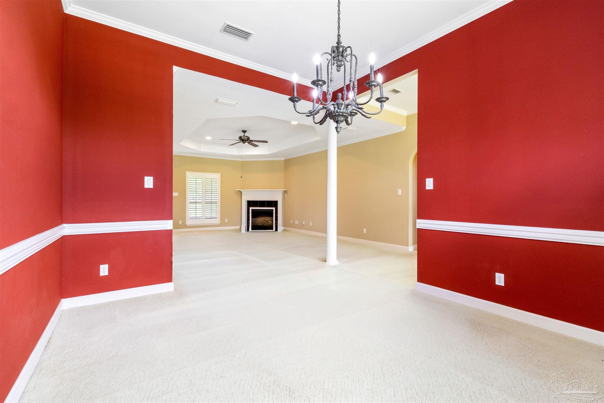 26064 Chatelaine Road Elberta, AL 36530 - Photo 15 of 52 a view of a livingroom with a stove and chandelier