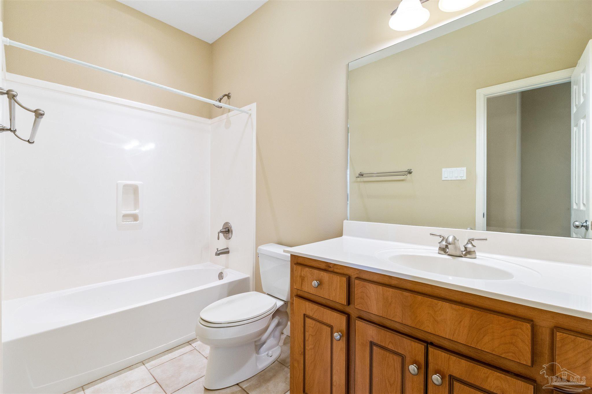 26064 Chatelaine Road Elberta, AL 36530 - Photo 17 of 52 a bathroom with a sink a toilet and shower
