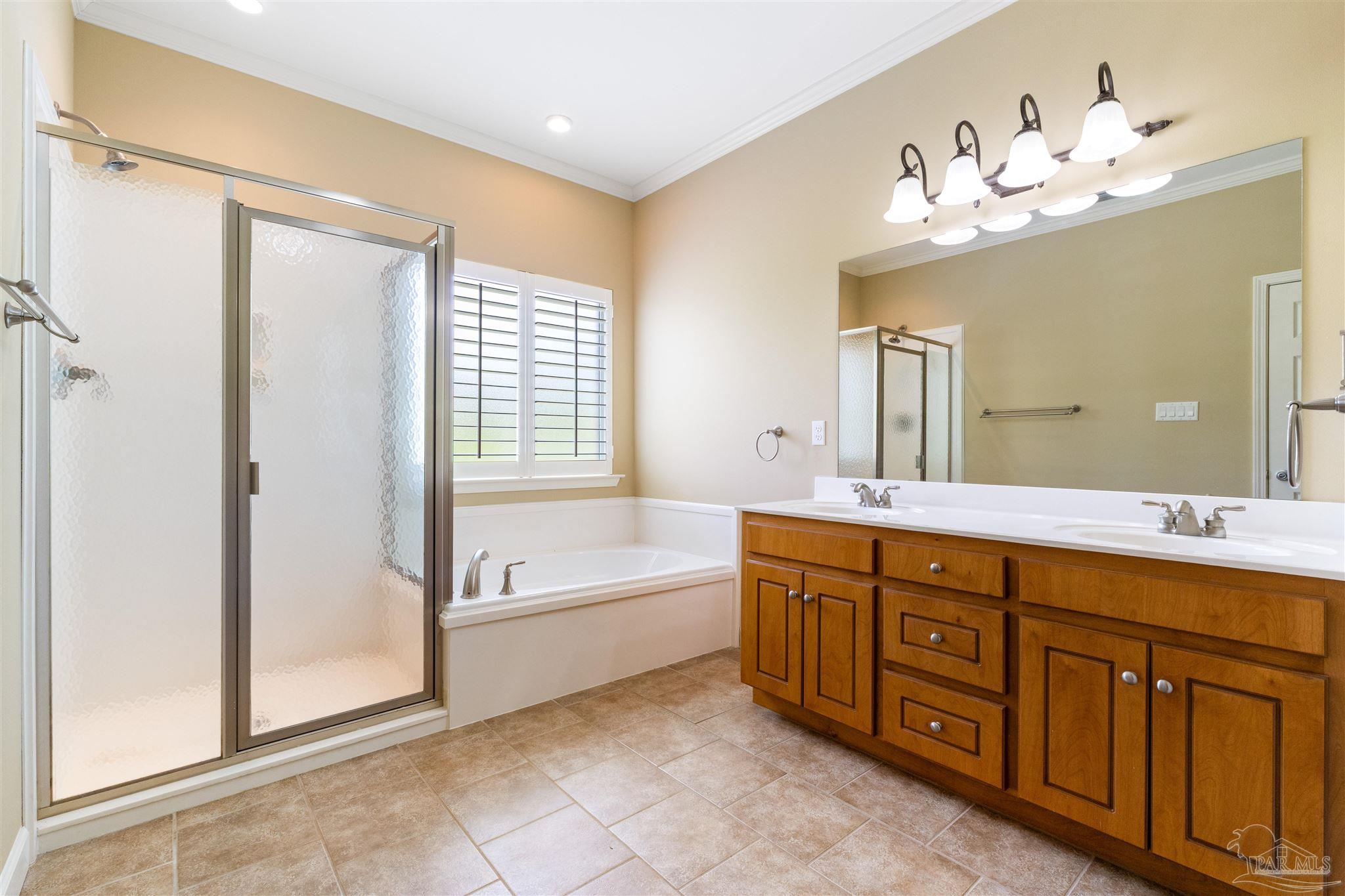 26064 Chatelaine Road Elberta, AL 36530 - Photo 20 of 52 a spacious bathroom with a double vanity sink tub double and mirror