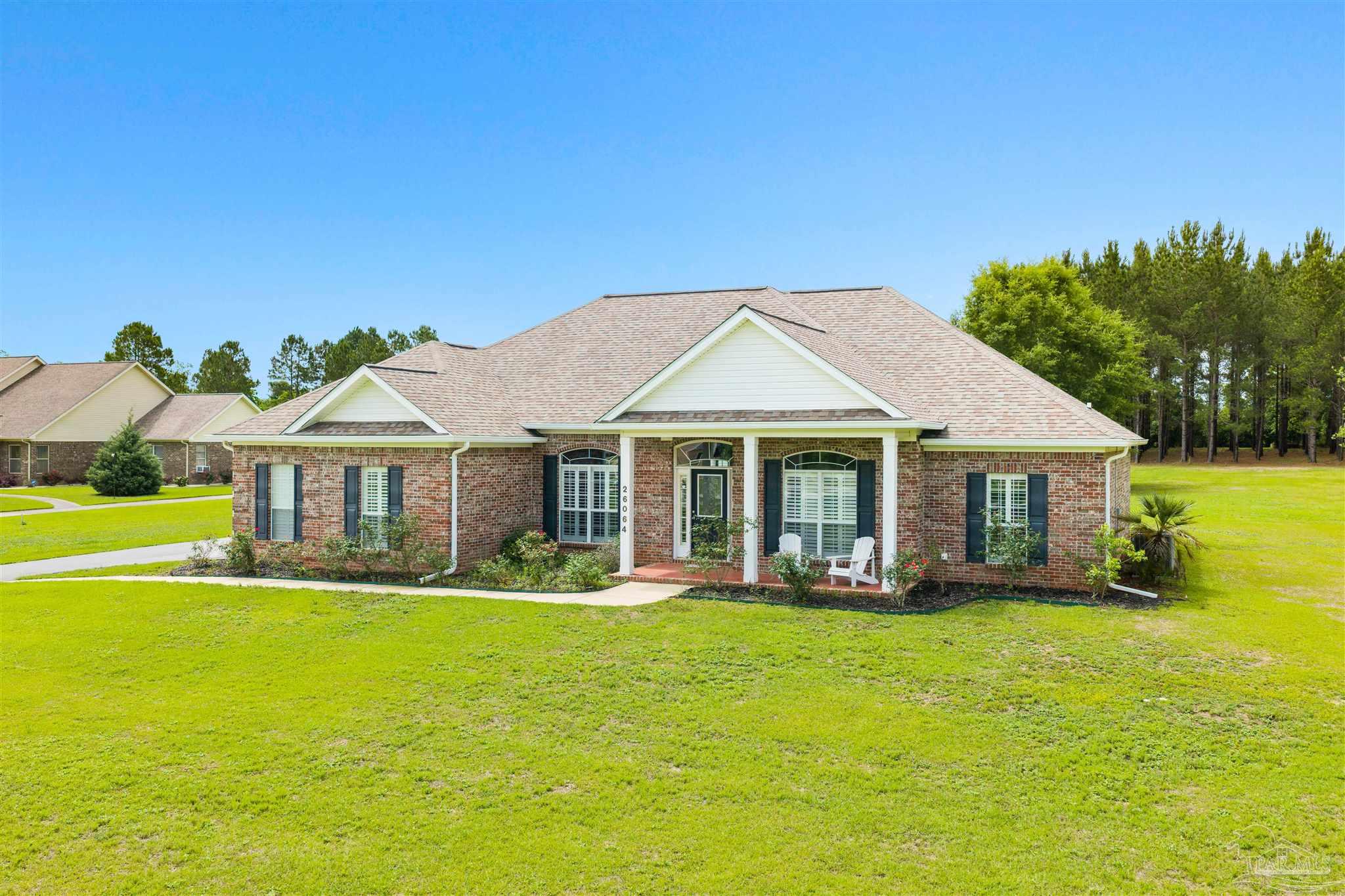 26064 Chatelaine Road Elberta, AL 36530 - Photo 2 of 52 a front view of a house with garden