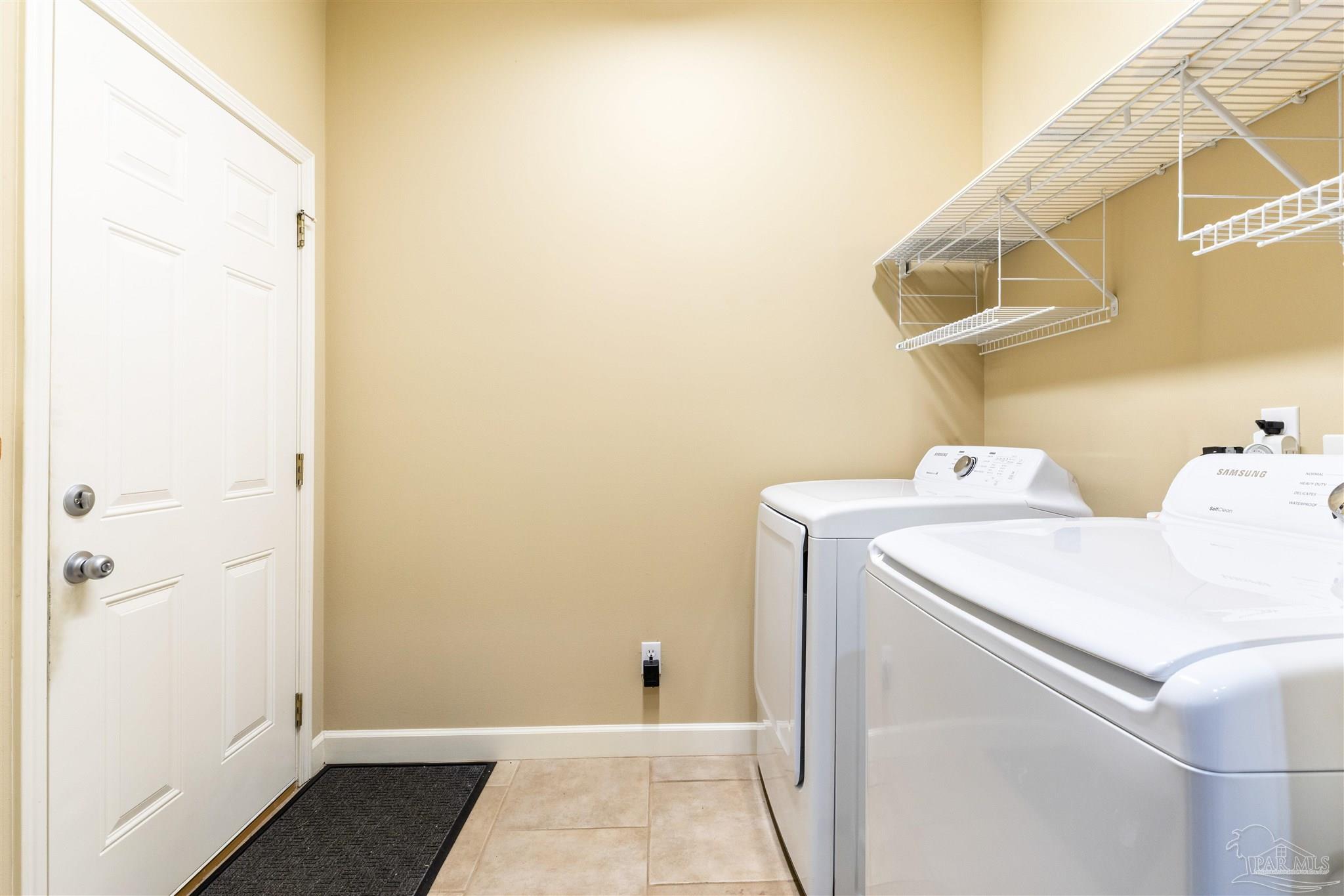 26064 Chatelaine Road Elberta, AL 36530 - Photo 24 of 52 a utility room with dryer and washer