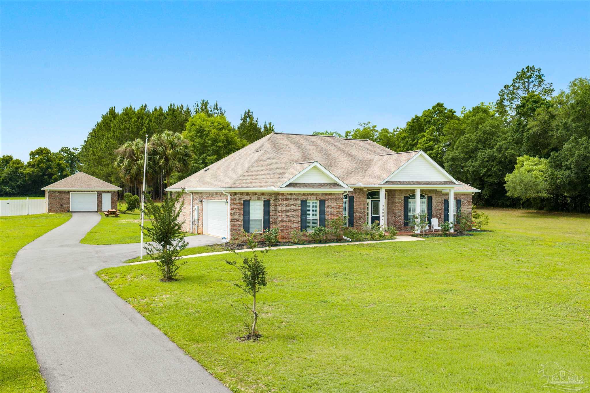 26064 Chatelaine Road Elberta, AL 36530 - Photo 3 of 52 a front view of house with yard and entertaining space