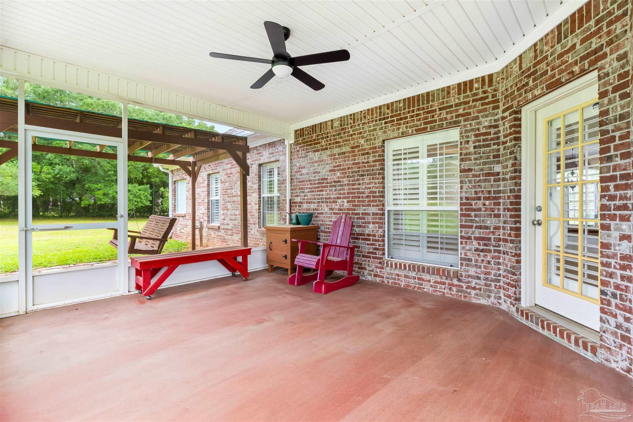 26064 Chatelaine Road Elberta, AL 36530 - Photo 32 of 52 a view of a room with gym equipment and floor to ceiling window