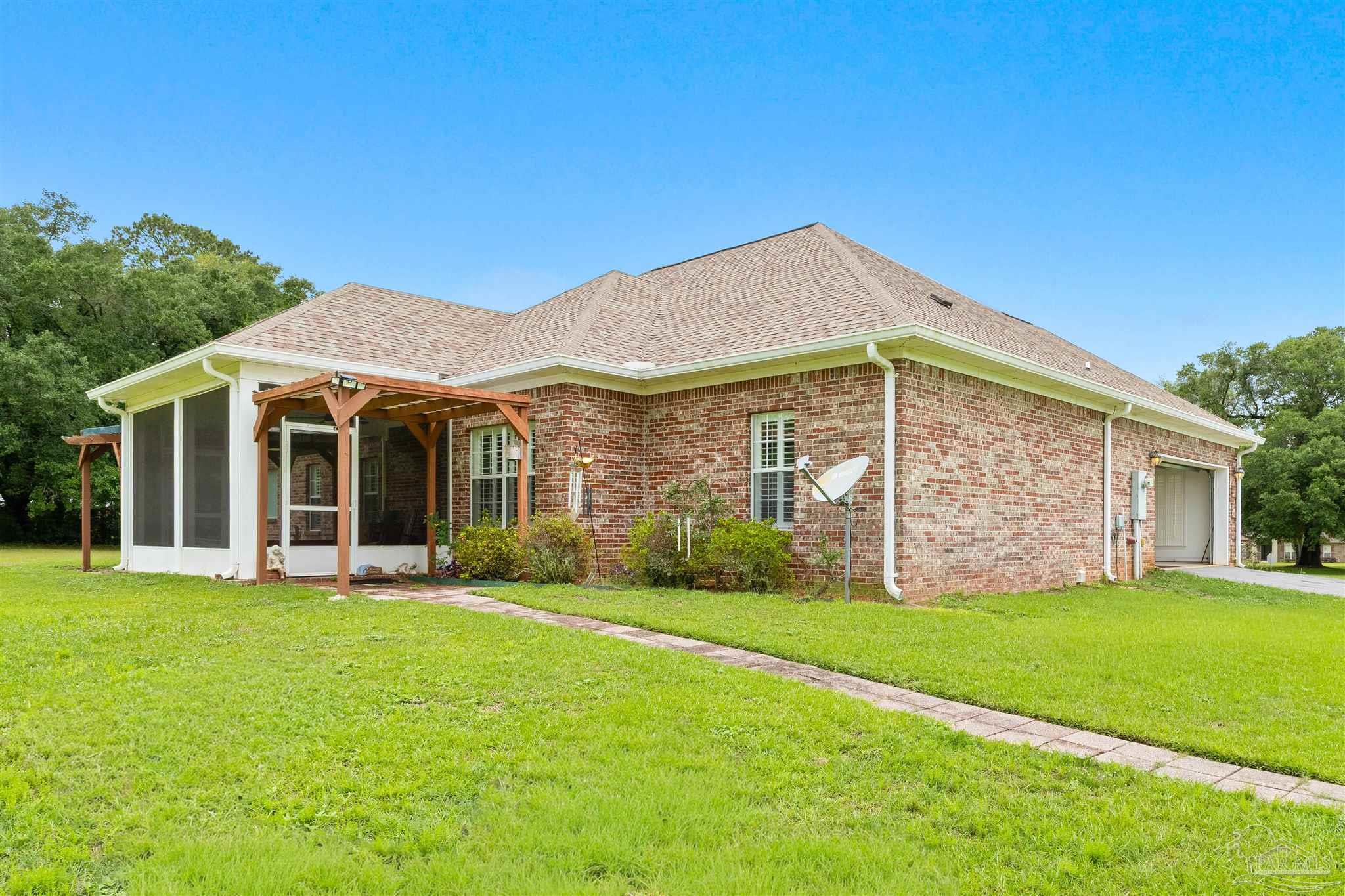 26064 Chatelaine Road Elberta, AL 36530 - Photo 36 of 52 a view of a house with a yard and sitting area