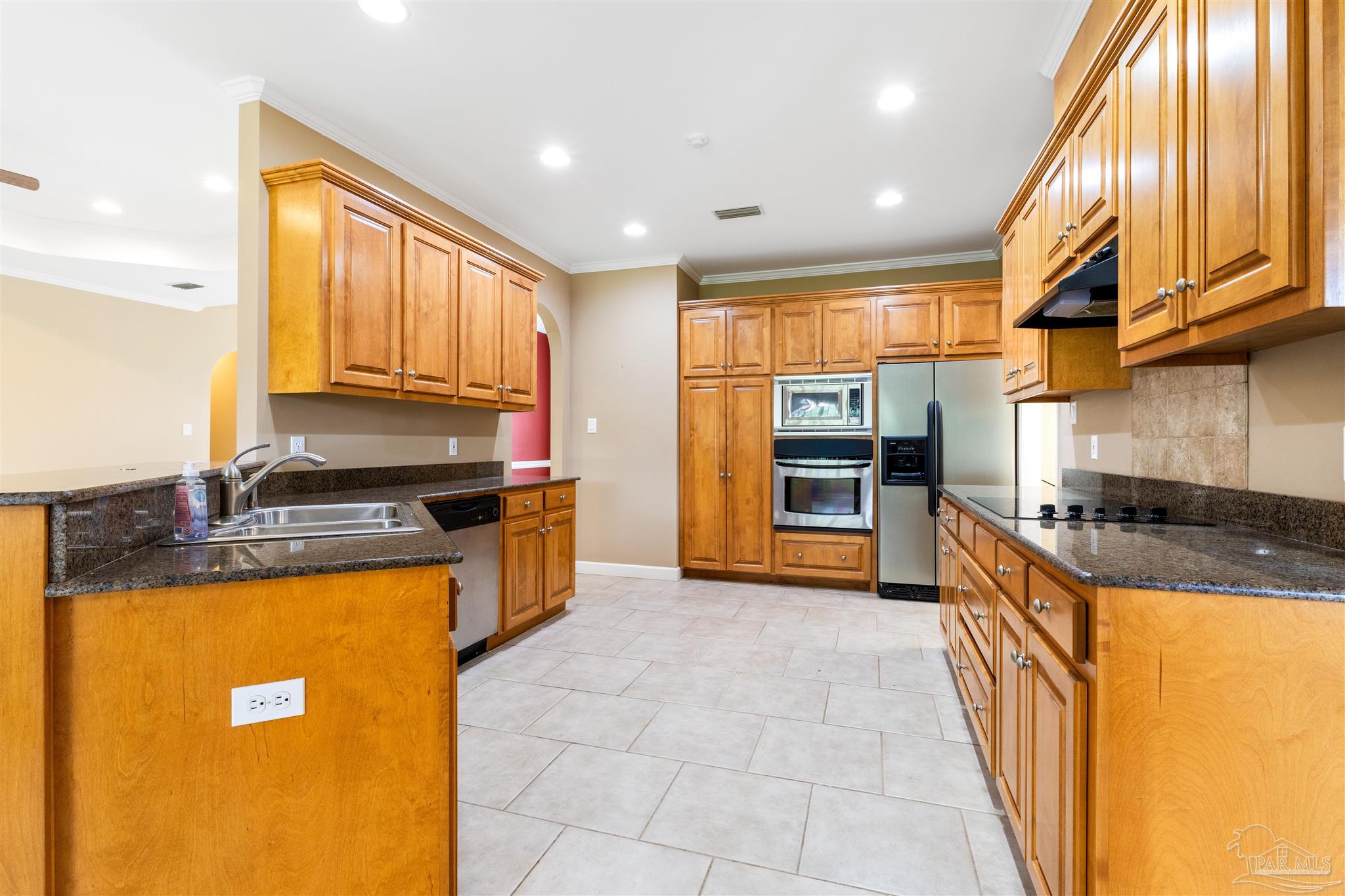 26064 Chatelaine Road Elberta, AL 36530 - Photo 4 of 52 a kitchen with kitchen island granite countertop a sink counter top space and stainless steel appliances