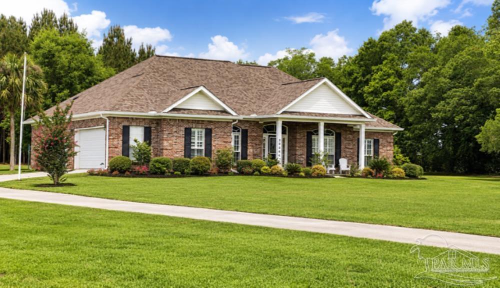 26064 Chatelaine Road Elberta, AL 36530 - Photo 52 of 52 a front view of a house with a garden