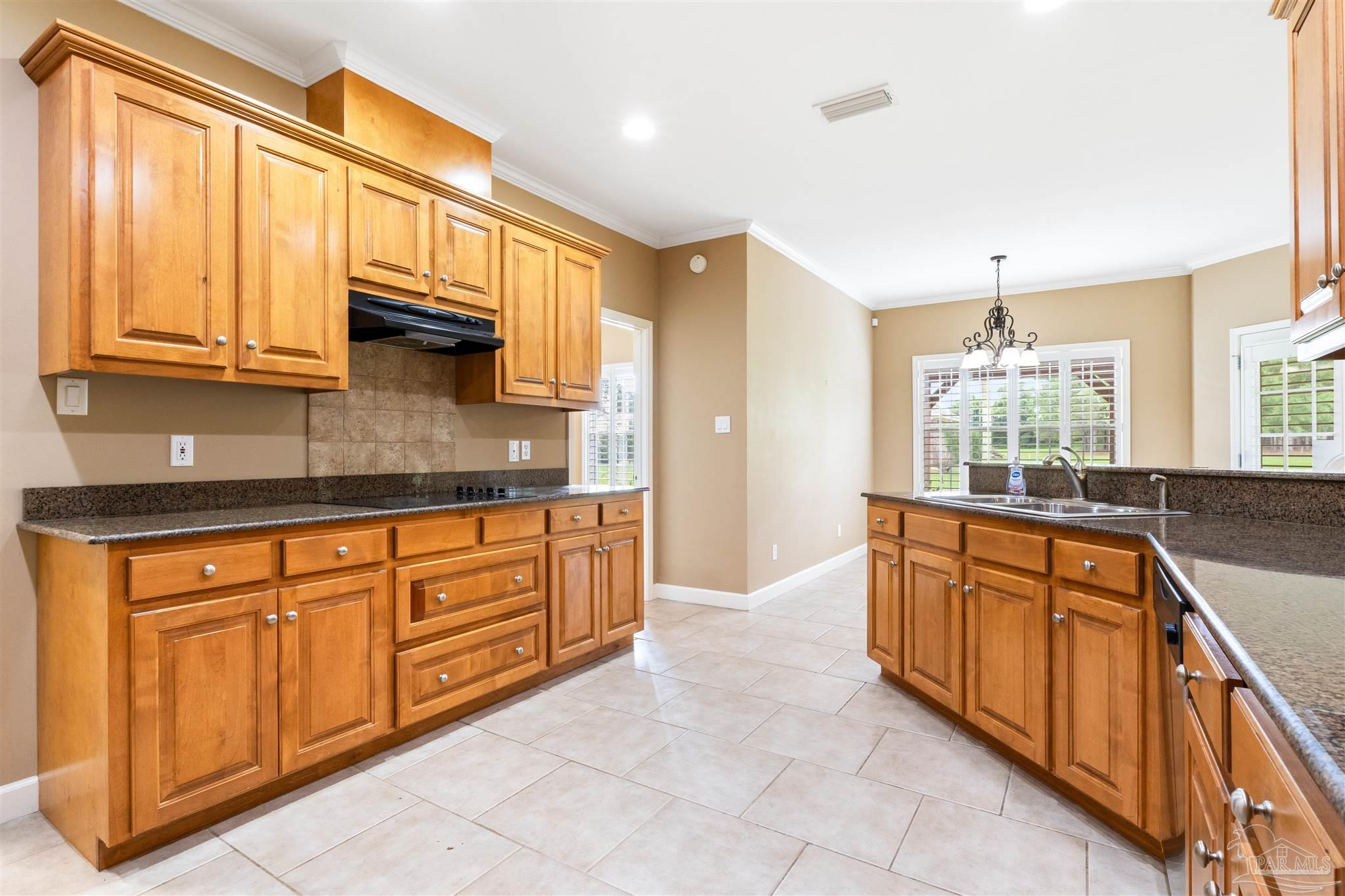 26064 Chatelaine Road Elberta, AL 36530 - Photo 7 of 52 a kitchen with stainless steel appliances granite countertop a sink and cabinets