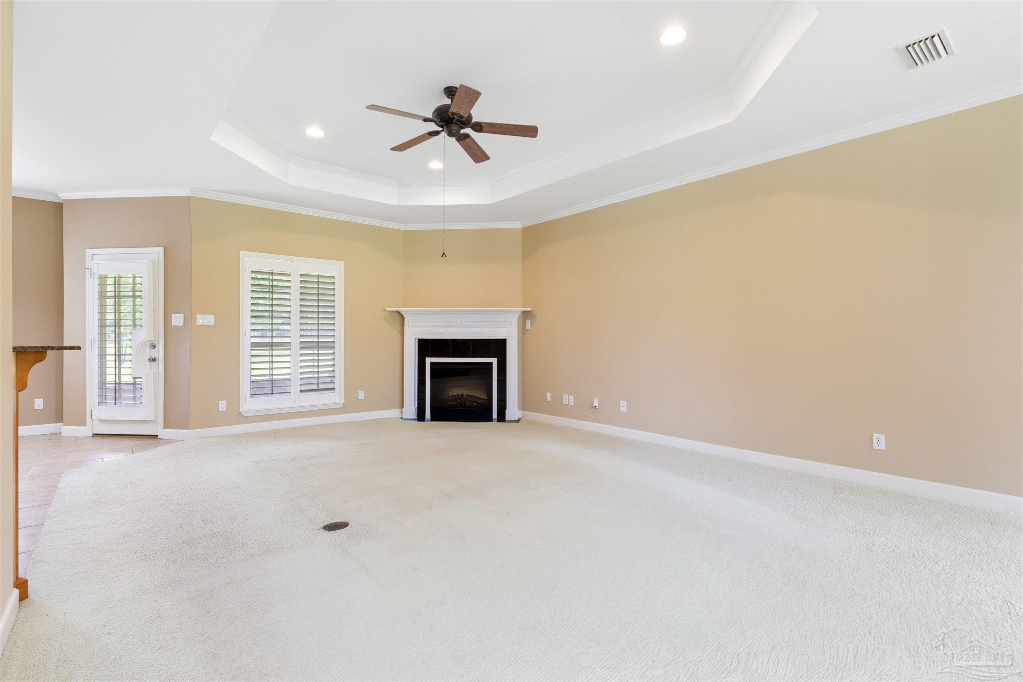 26064 Chatelaine Road Elberta, AL 36530 - Photo 9 of 52 an empty room with windows and fireplace