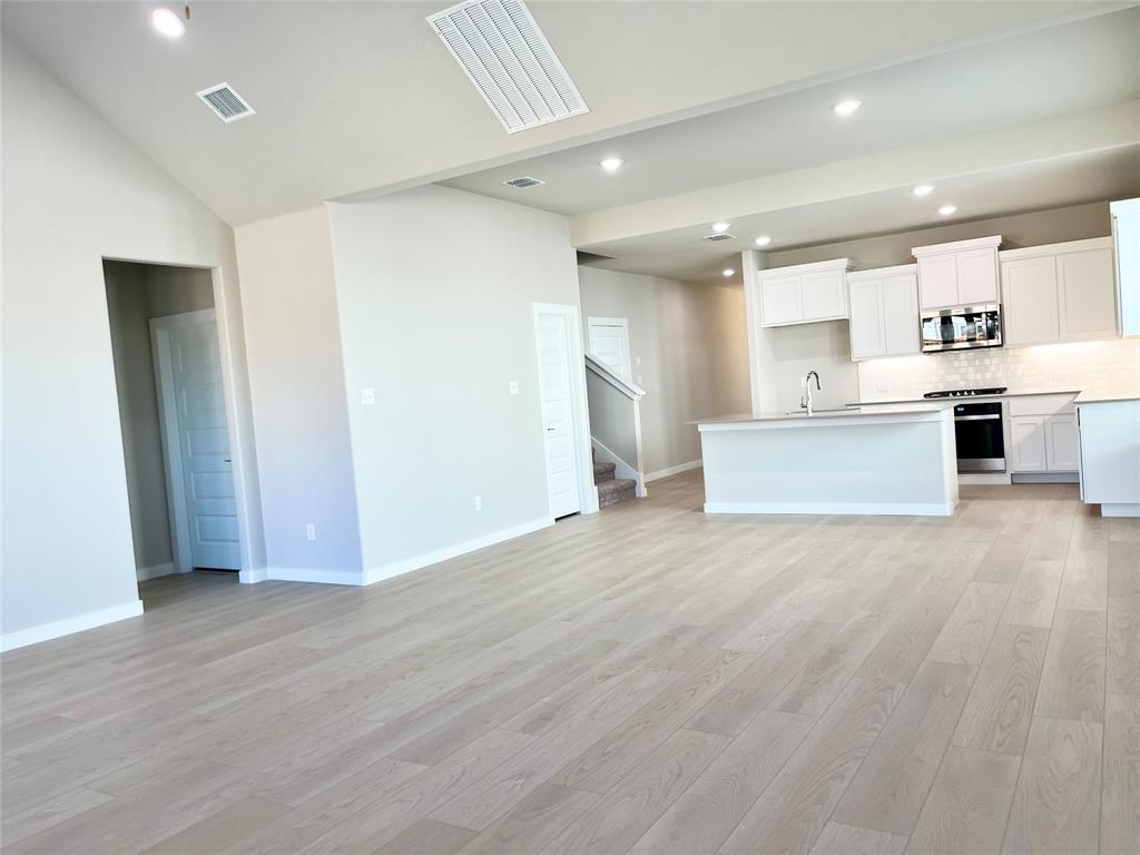 1904 Edgewater Street Celina, TX 75009 - Photo 5 of 11 a view of kitchen with wooden floor and electronic appliances