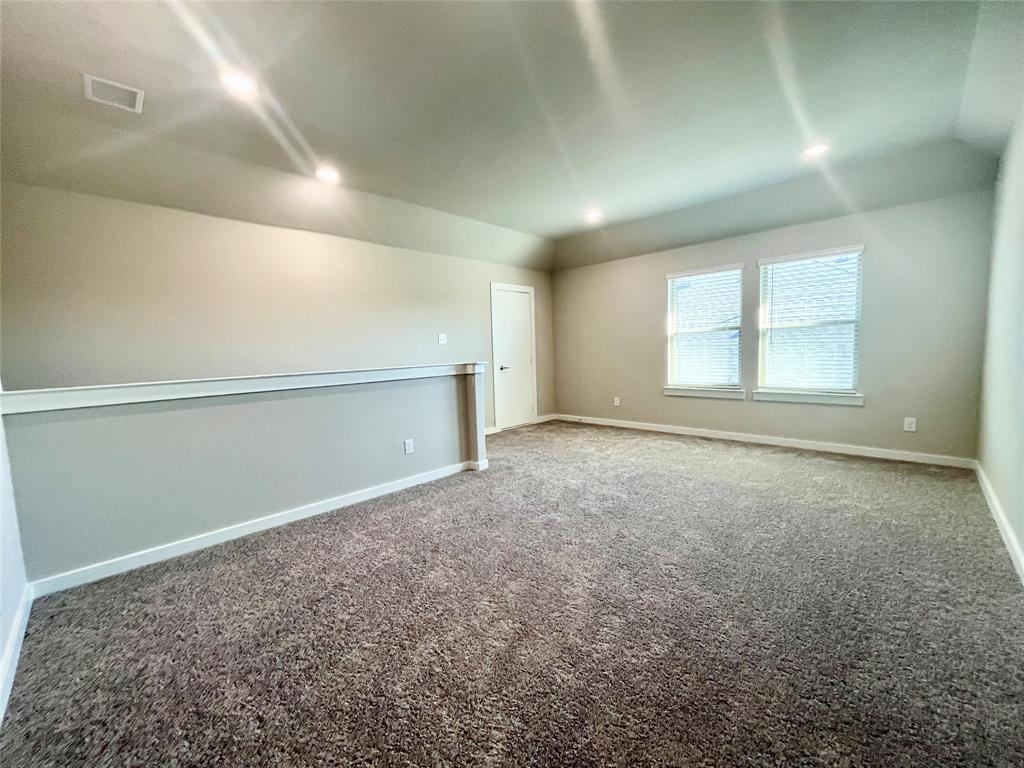 1904 Edgewater Street Celina, TX 75009 - Photo 8 of 11 an empty room with a empty space and windows